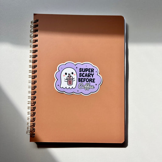 Ghost drinking coffee withe the words SUPER SCARY BEFORE Coffee with a light Purple background
