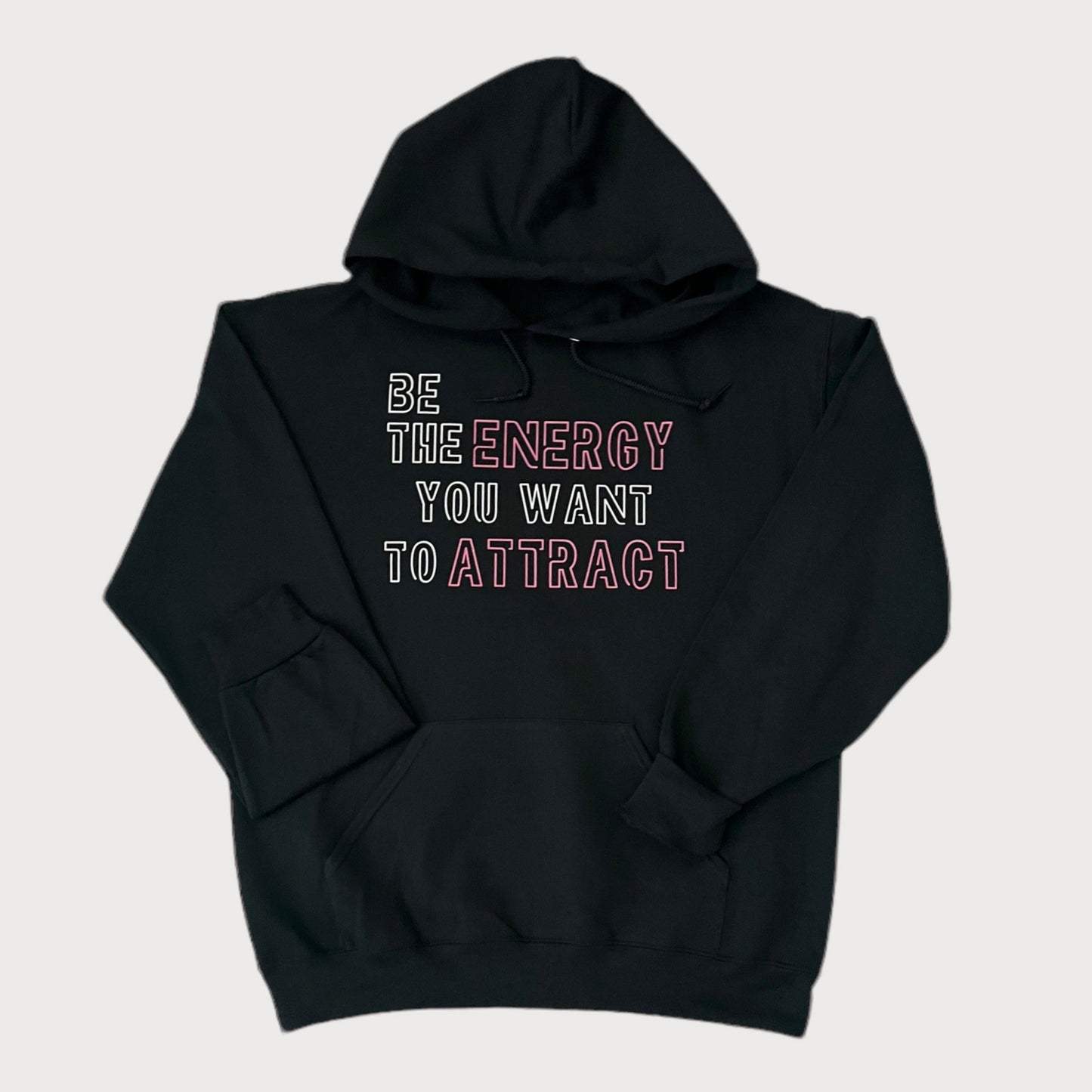 Be The Energy You Want To Attract Black Sweatshirt Hoodie With White/Pink Design