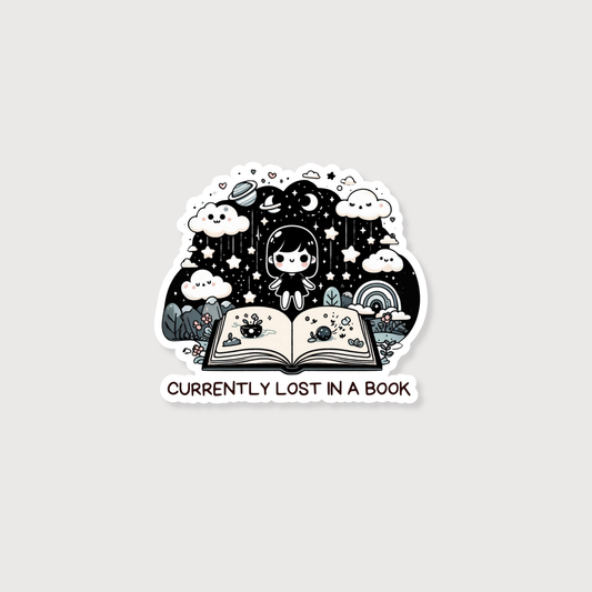 A die-cut sticker featuring a person sitting inside an open book surrounded by stars, clouds, rain, and a rainbow, with the text 'CURRENTLY LOST IN A BOOK' below, shown on a light gray background.
