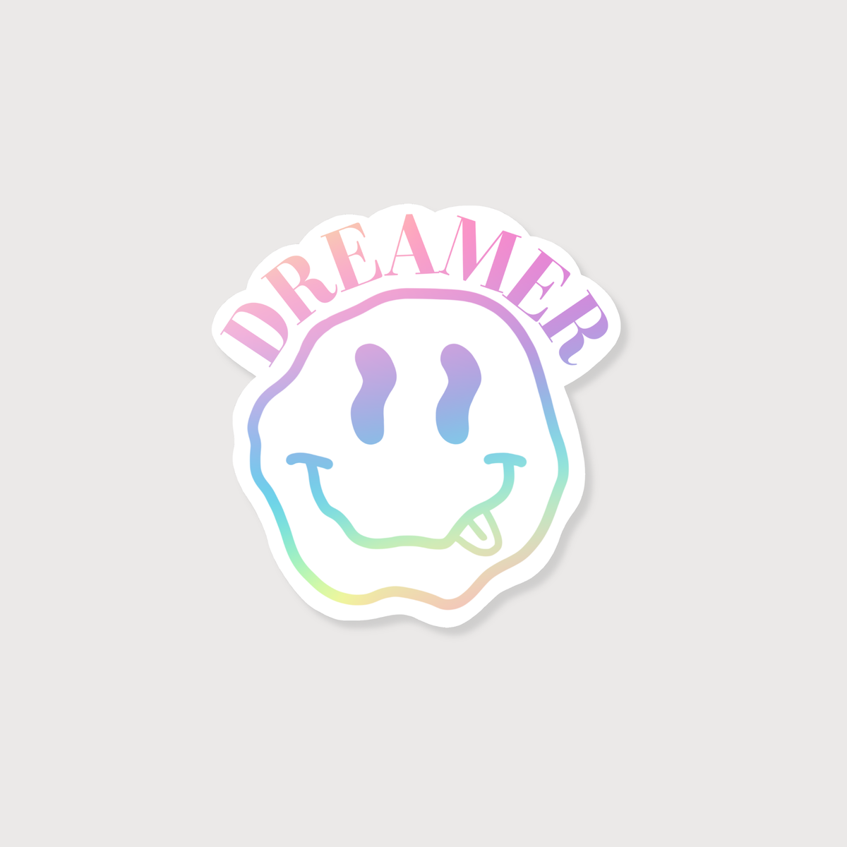 Sticker with smiley face design and 'DREAMER' text on a light gray background