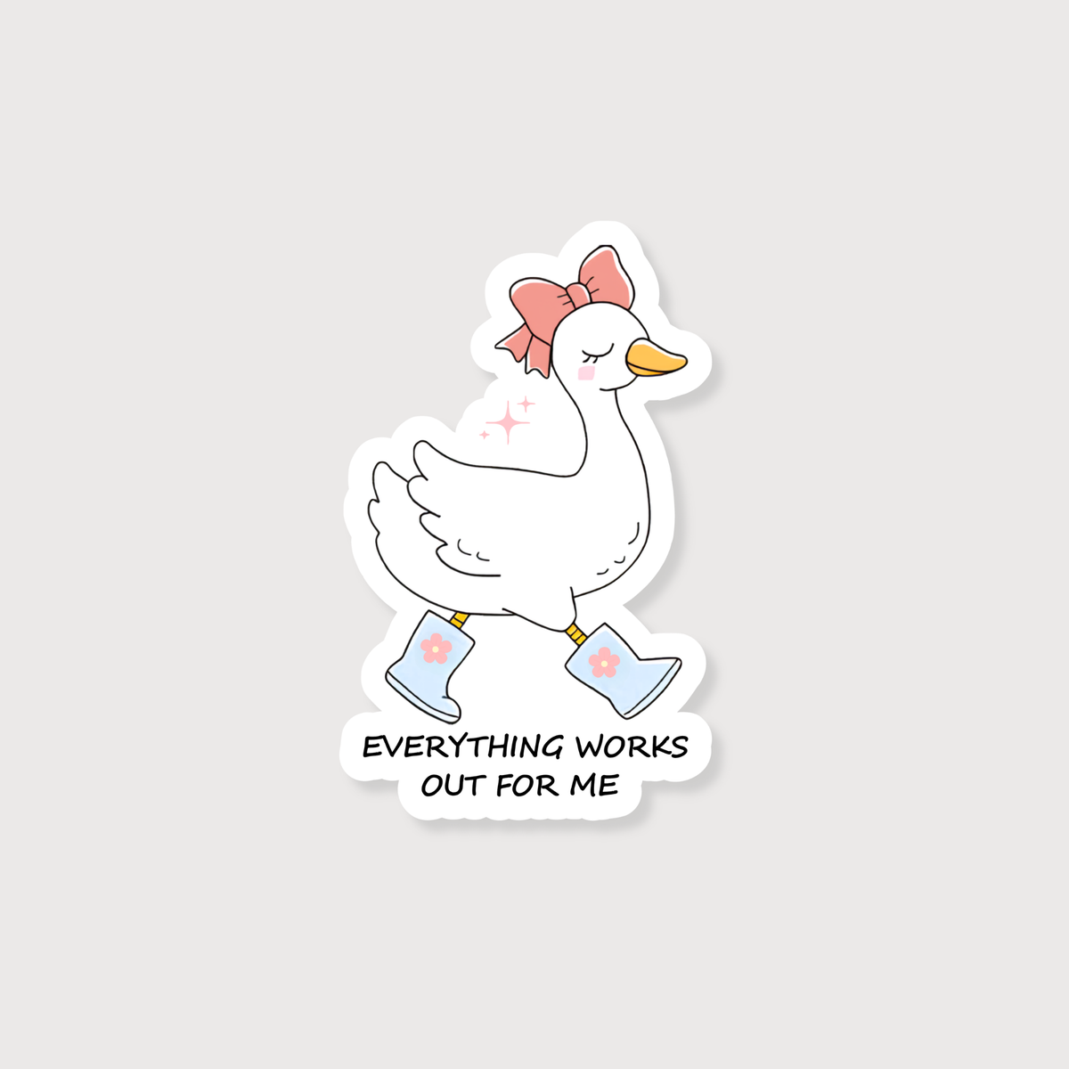 A die-cut sticker featuring a cute cartoon goose walking in light blue rain boots with a pink bow on its head. Below the goose, the text reads 'EVERYTHING WORKS OUT FOR ME' in black capital letters.