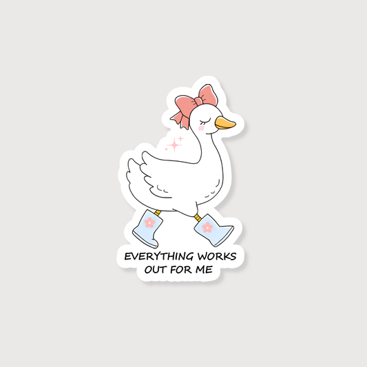 A die-cut sticker featuring a cute cartoon goose walking in light blue rain boots with a pink bow on its head. Below the goose, the text reads 'EVERYTHING WORKS OUT FOR ME' in black capital letters.