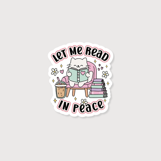 Sticker with a cat reading a book, coffee, and books with 'Let Me Read In Peace' text on a light gray background.