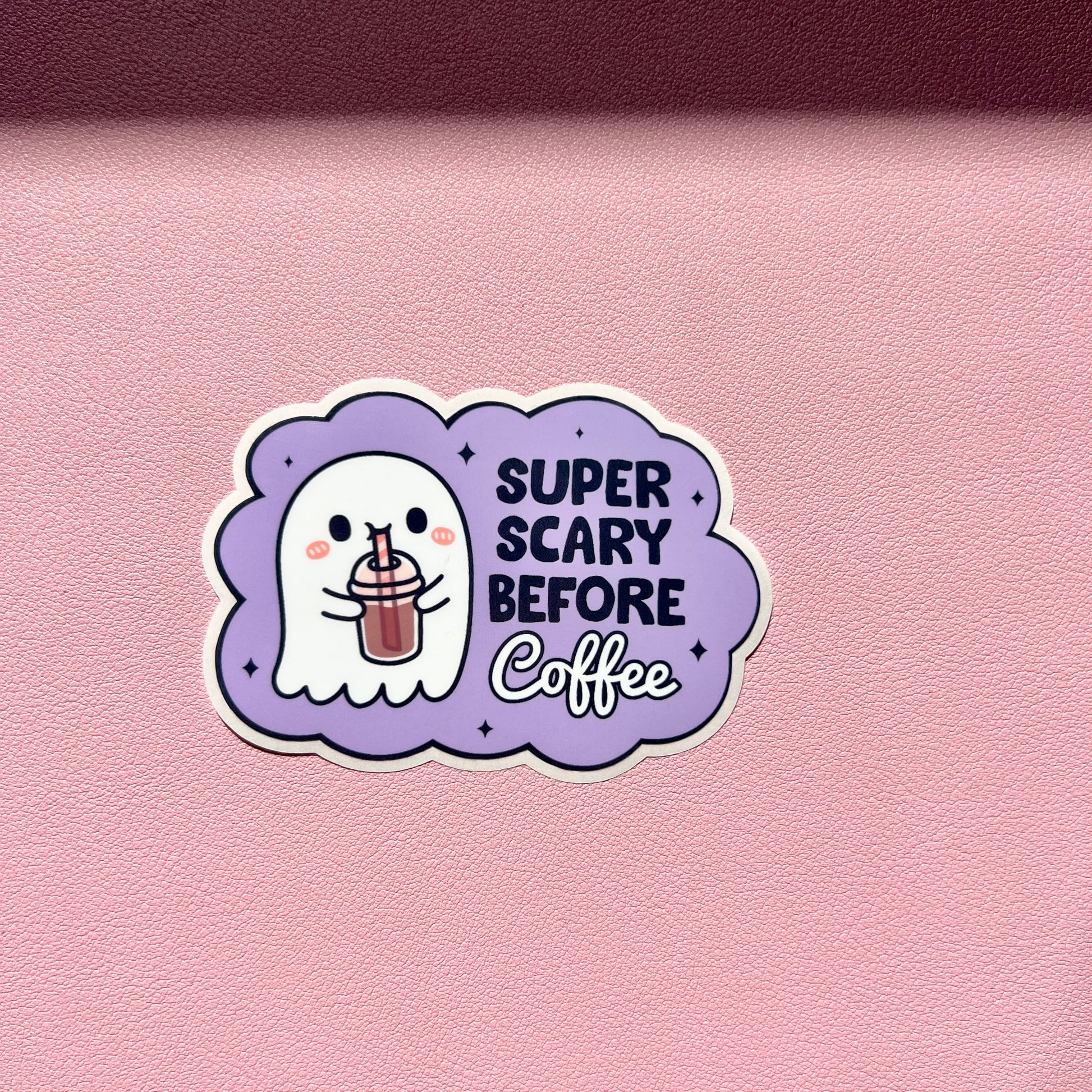 Ghost drinking coffee withe the words SUPER SCARY BEFORE Coffee with a light Purple background